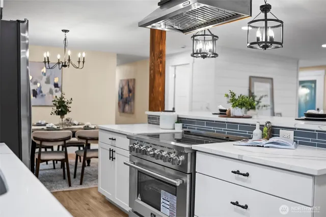 a kitchen with a sink stove and microwave