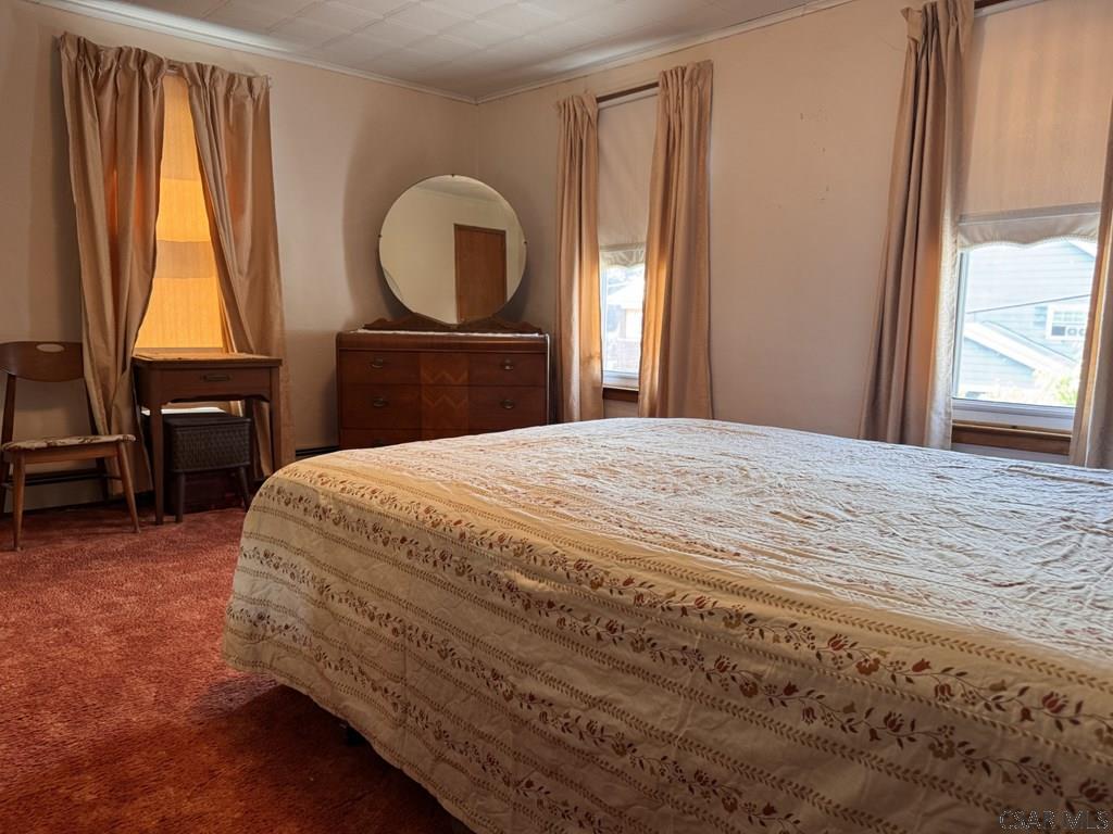 139 Reed Street Elmora, PA 15737 - Photo 18 of 23 a bedroom with a bed and a dresser next to a window