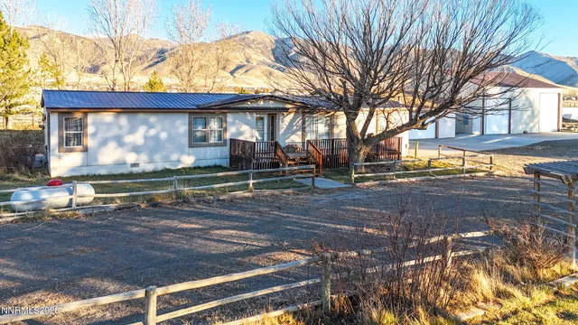 a view of a street with brick walls