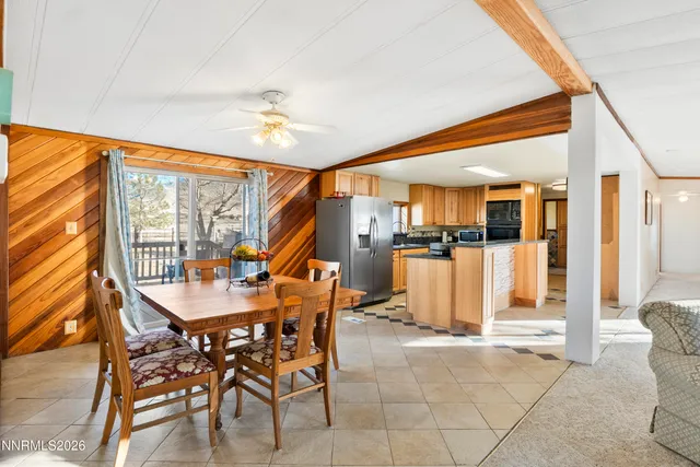 a dining room with furniture and entryway