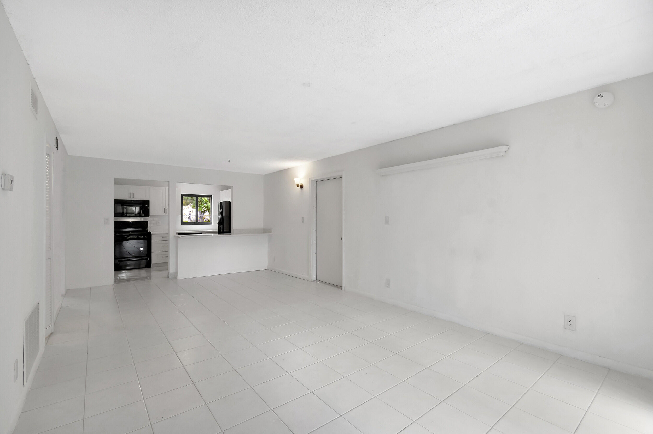 50 Southeast 12th Street, Unit 165 Boca Raton, FL 33432 - Photo 10 of 36 Living Room/Dining Room/Kitchen