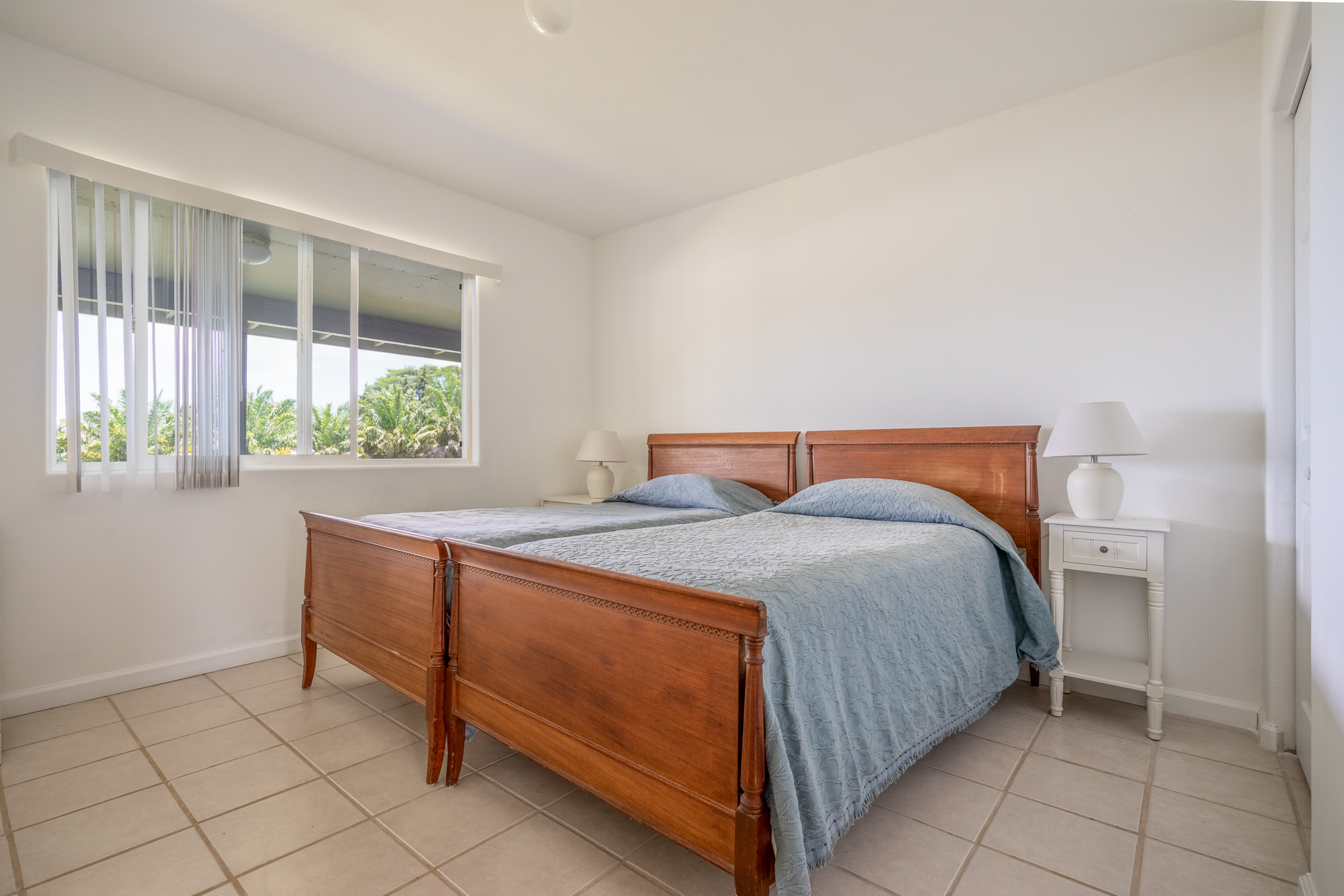 18-3840 South Lauko Road Mountain View, HI 96771 - Photo 14 of 30 a bedroom with a bed and a window