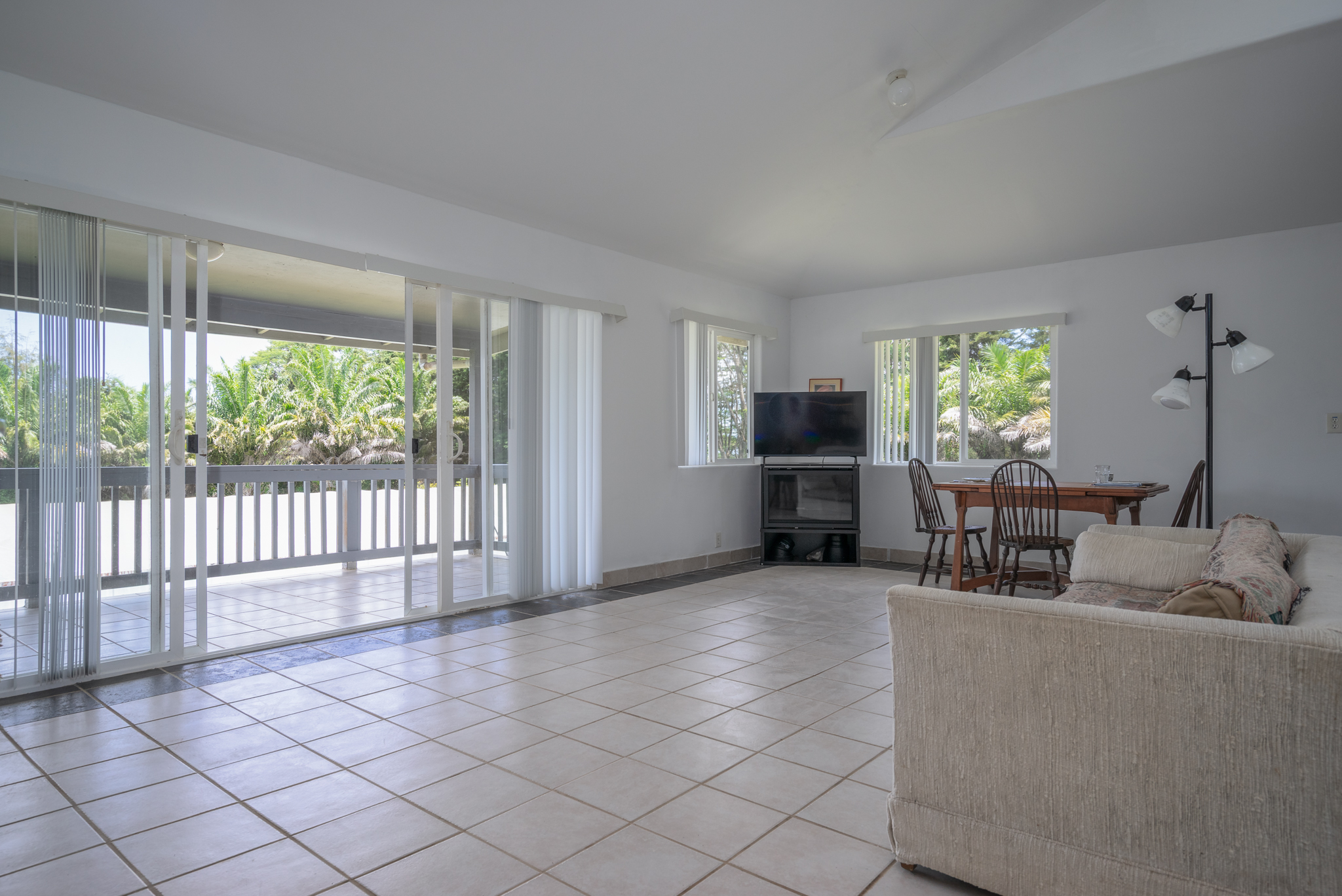 18-3840 South Lauko Road Mountain View, HI 96771 - Photo 17 of 30 a living room with furniture a window and stainless steel appliances