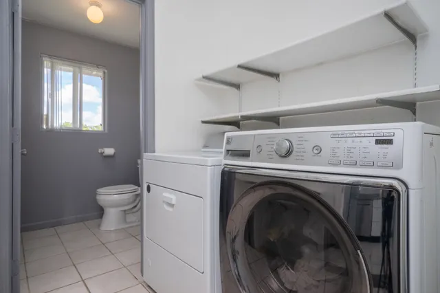 a view of washer and dryer in a utility room