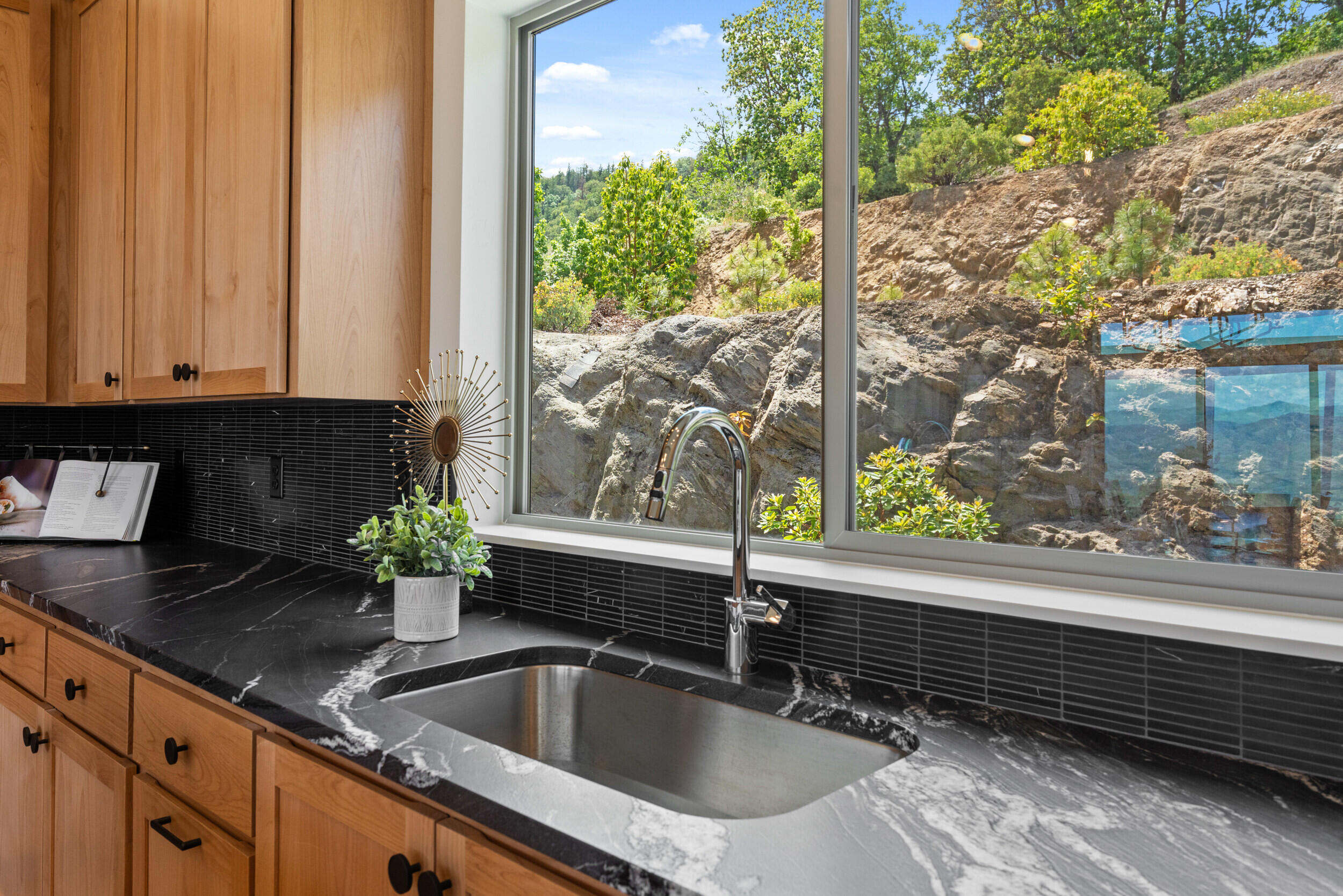 3060 Ashland Mine Road Talent, OR 97540 - Photo 15 of 43 a kitchen with a sink and a large window