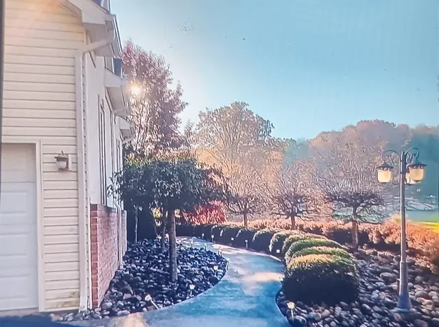 a front view of a house with yard