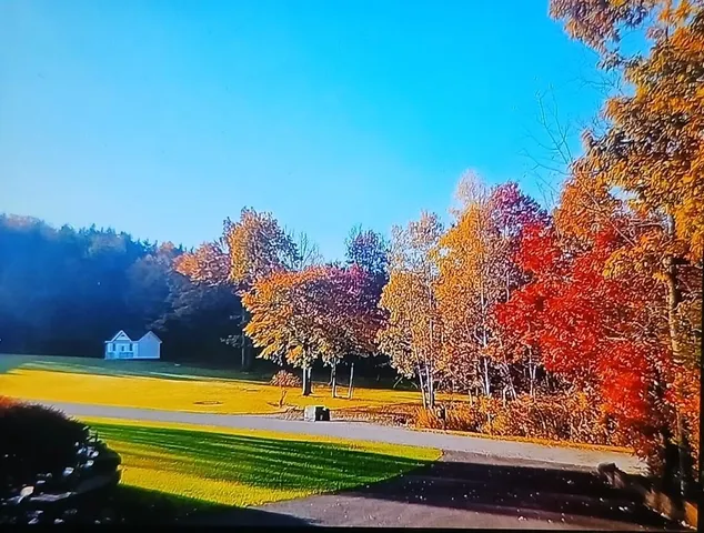 a view of a swimming pool with an outdoor space and seating area