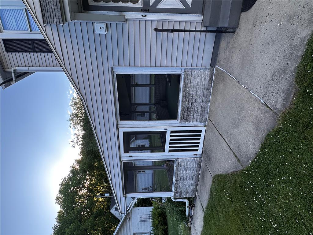 5128 3rd Street Whitehall, PA 18052 - Photo 5 of 26 A well-maintained side exterior provides a private entry with a screened porch.
