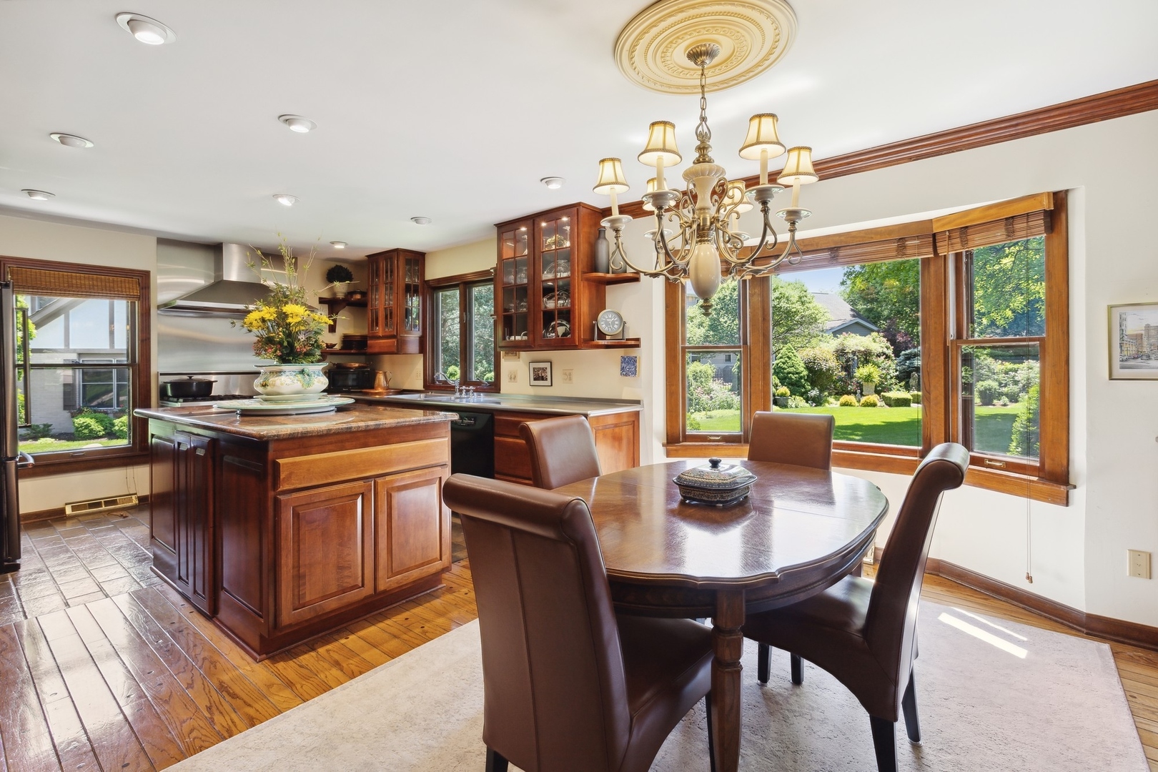 21 Winthrop New Road Sugar Grove, IL 60554 - Photo 8 of 31 a kitchen with a dining table and chairs