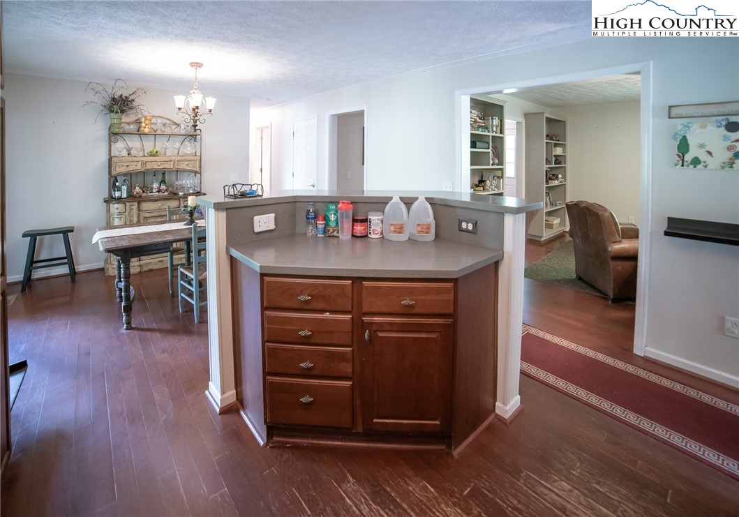 182 Henley Lane Newland, NC 28657 - Photo 12 of 28 a living room with furniture and a wooden floor