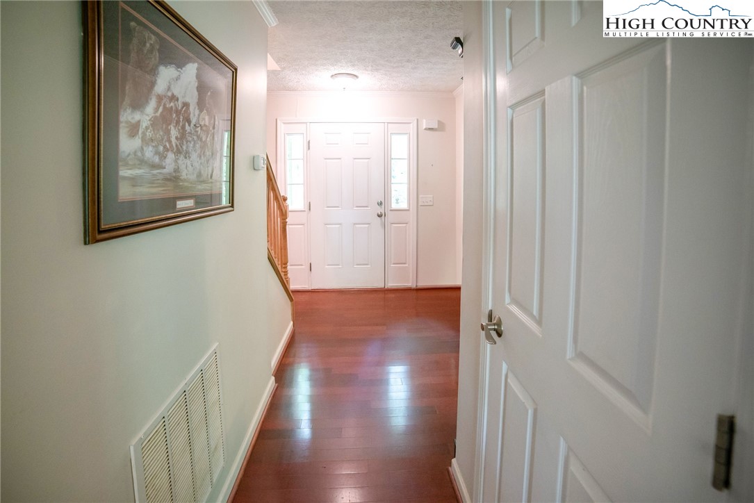 182 Henley Lane Newland, NC 28657 - Photo 20 of 28 a view of hallway with wooden floor
