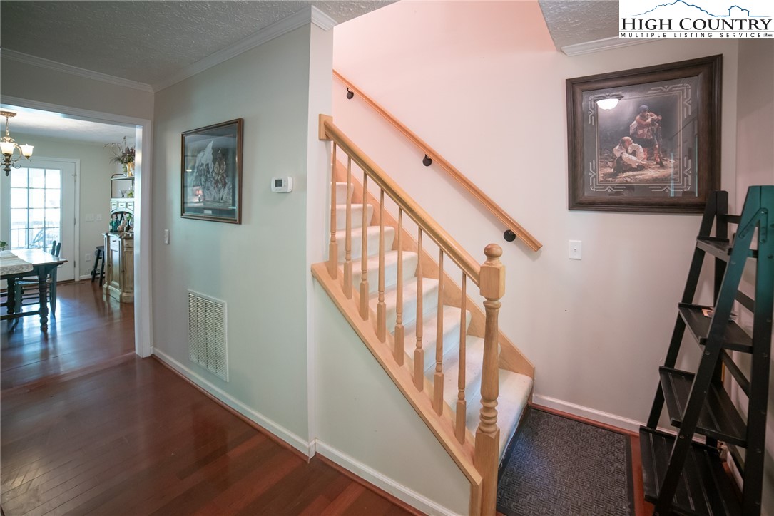182 Henley Lane Newland, NC 28657 - Photo 21 of 28 a view of an entryway with wooden floor and stairs