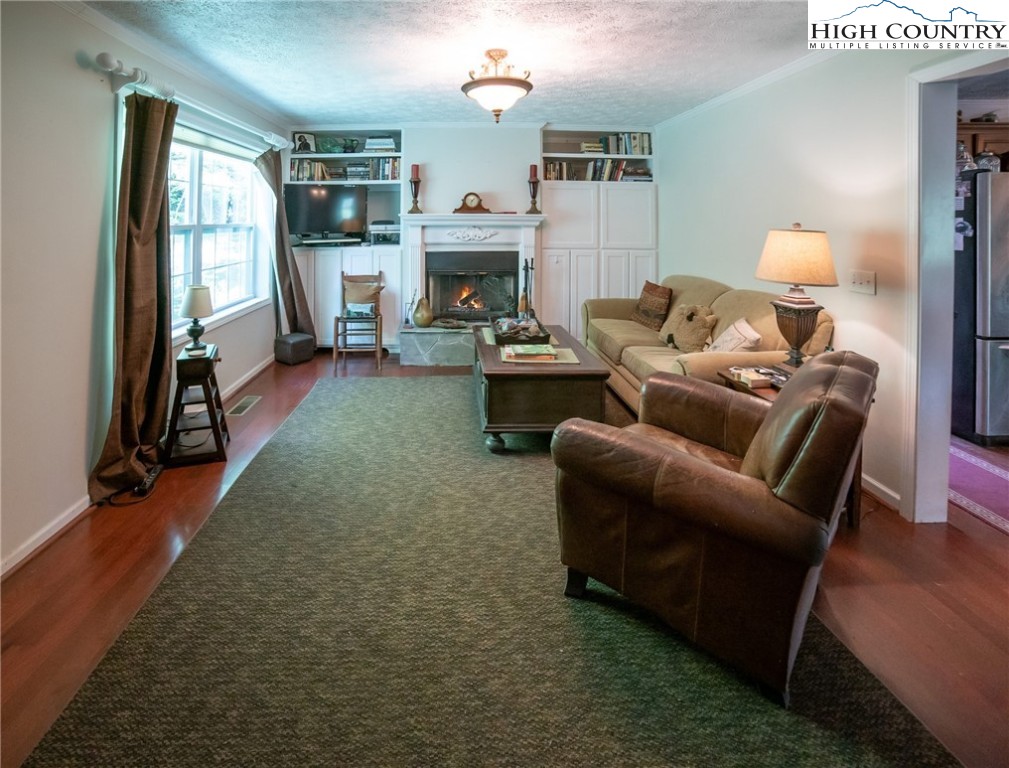 182 Henley Lane Newland, NC 28657 - Photo 7 of 28 a living room with furniture and a fireplace