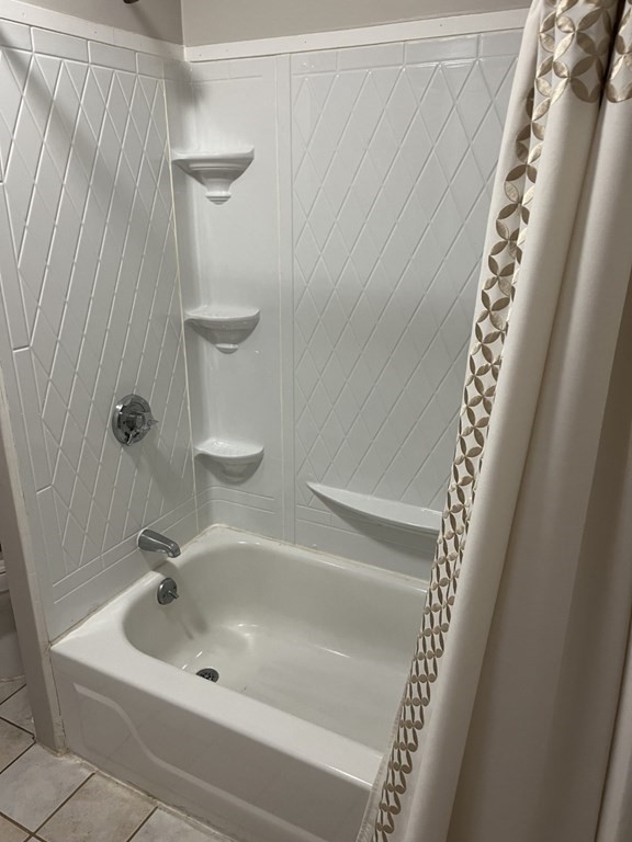 5 State Street, Unit R1 Worcester, MA 01609 - Photo 16 of 26 a white bath tub sitting next to a sink