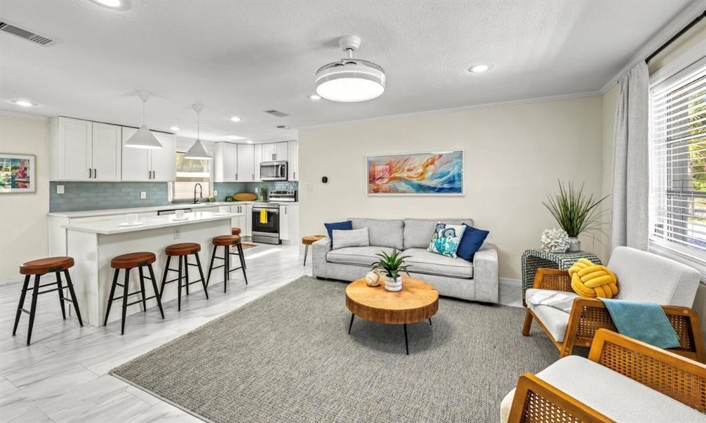 578 Companion Way Longboat Key, FL 34228 - Photo 18 of 70 a living room with furniture and a table