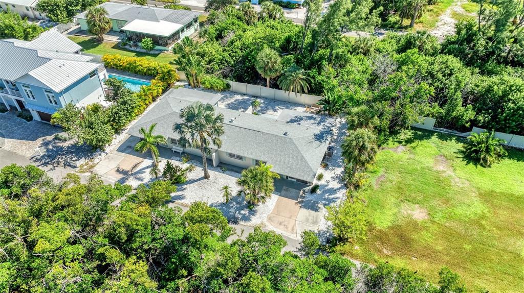 578 Companion Way Longboat Key, FL 34228 - Photo 3 of 70 an aerial view of residential house with outdoor space and trees all around