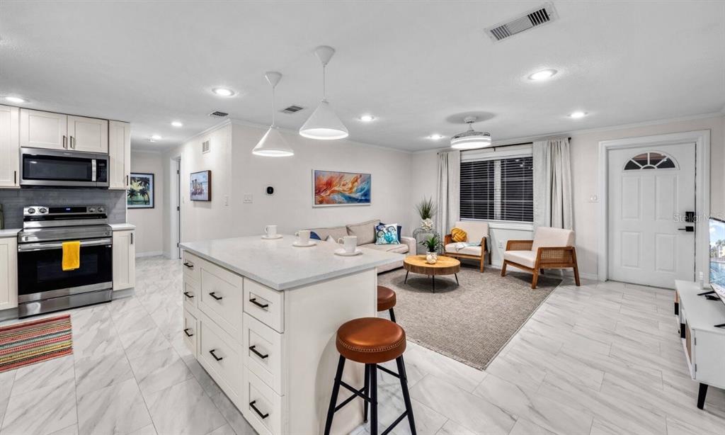 578 Companion Way Longboat Key, FL 34228 - Photo 39 of 70 a living room with furniture and a flat screen tv