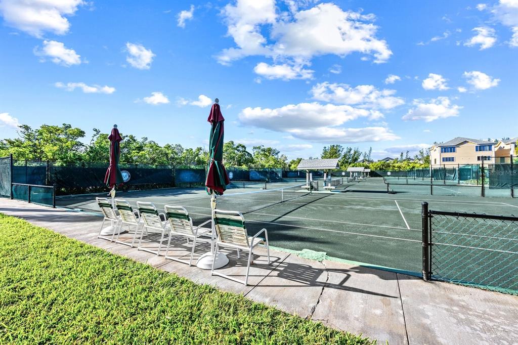 578 Companion Way Longboat Key, FL 34228 - Photo 4 of 70 a view of a swimming pool with a patio and a yard