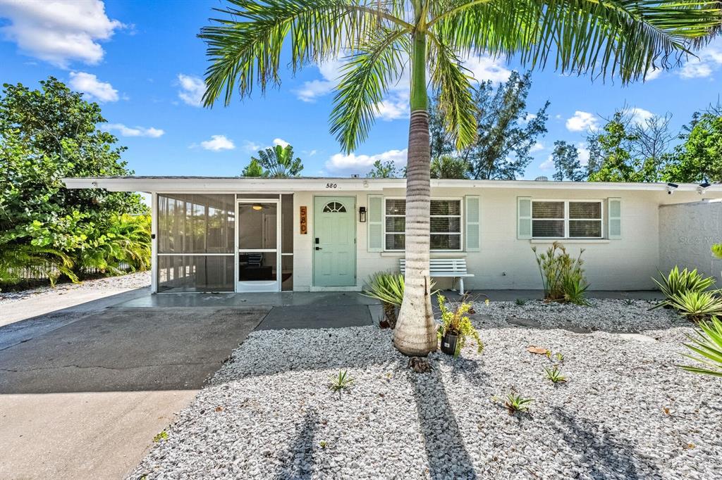 578 Companion Way Longboat Key, FL 34228 - Photo 59 of 70 a front view of a house with a yard