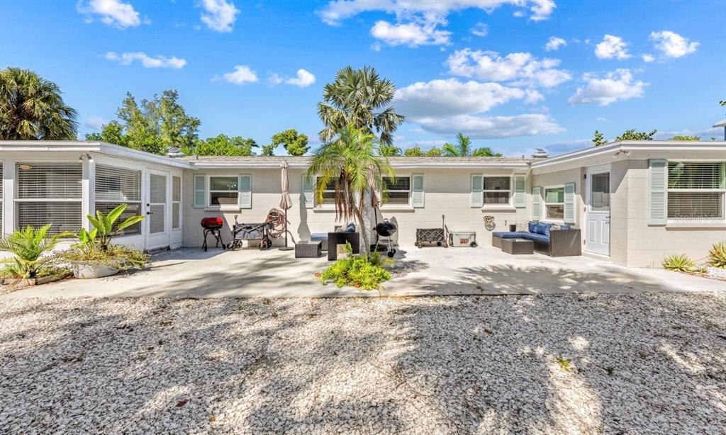 578 Companion Way Longboat Key, FL 34228 - Photo 64 of 70 a view of a house with backyard porch and sitting area