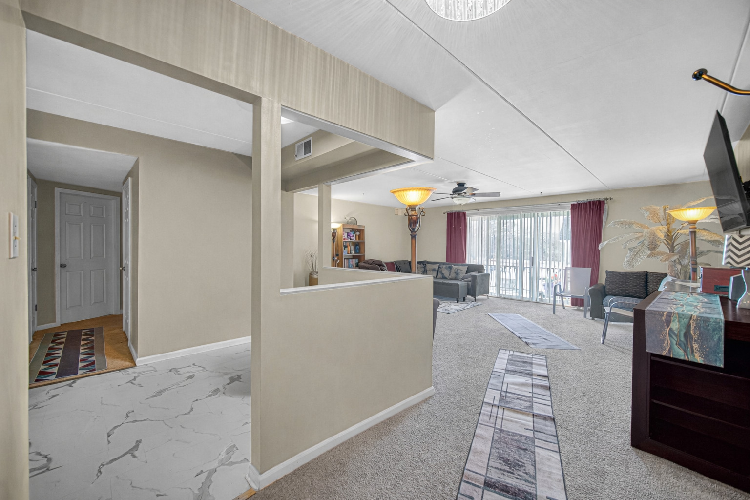 18559 Escanaba Avenue, Unit 201 Lansing, IL 60438 - Photo 7 of 17 a living room with furniture and a table