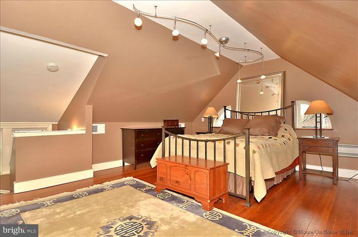 9423 Thornhill Road Silver Spring, MD 20901 - Photo 2 of 30 a spacious bedroom with a bed and a window