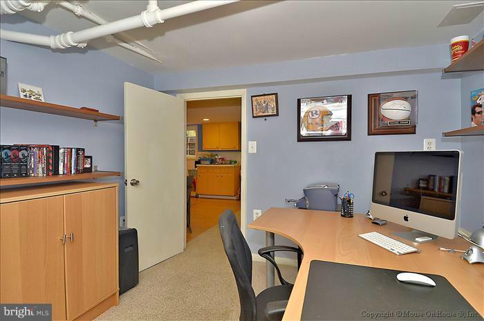 9423 Thornhill Road Silver Spring, MD 20901 - Photo 11 of 30 a workspace with furniture and a table