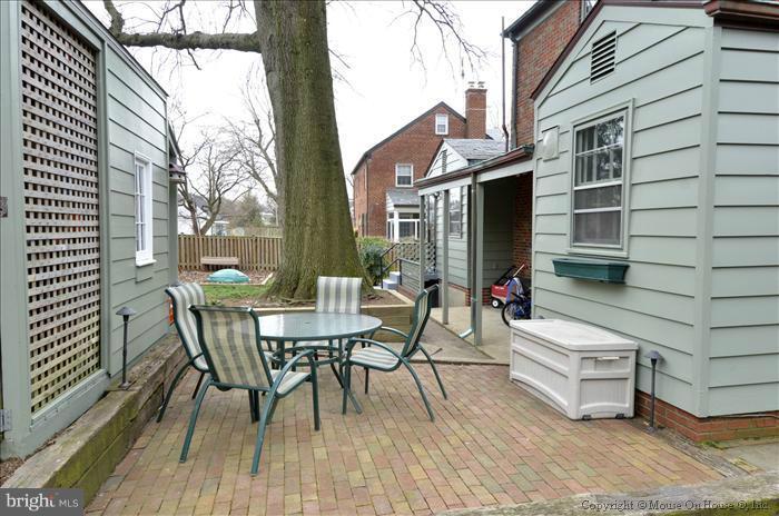 9423 Thornhill Road Silver Spring, MD 20901 - Photo 12 of 30 a view of a patio with a table and chairs