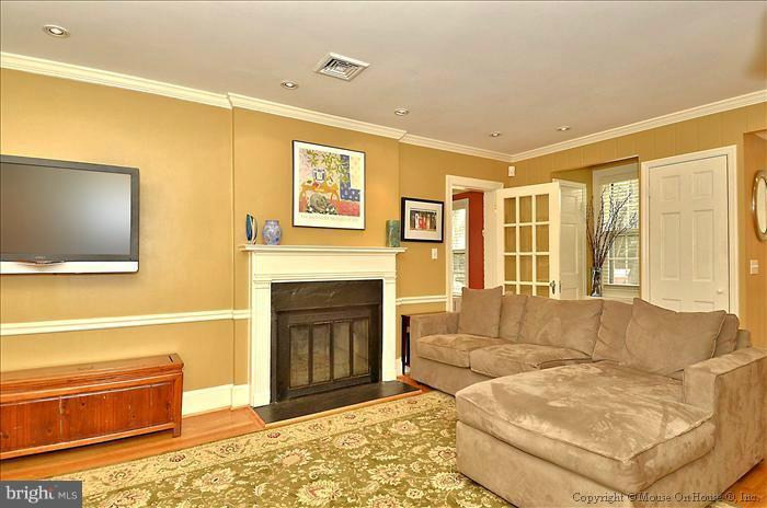 9423 Thornhill Road Silver Spring, MD 20901 - Photo 14 of 30 a living room with furniture and a flat screen tv