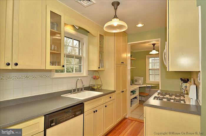 9423 Thornhill Road Silver Spring, MD 20901 - Photo 15 of 30 a kitchen with a sink stove and refrigerator