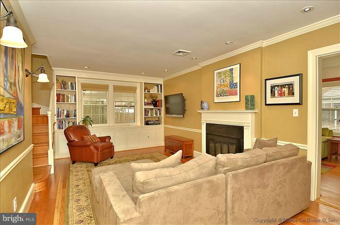 9423 Thornhill Road Silver Spring, MD 20901 - Photo 17 of 30 a living room with furniture and a fireplace