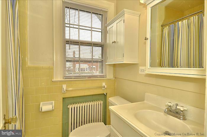 9423 Thornhill Road Silver Spring, MD 20901 - Photo 26 of 30 a bathroom with a sink and mirror with toilet