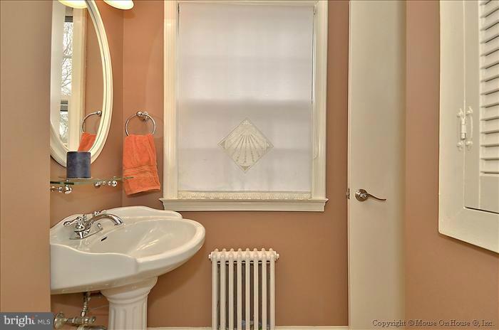 9423 Thornhill Road Silver Spring, MD 20901 - Photo 5 of 30 a bathroom with a sink and a mirror