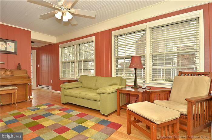 9423 Thornhill Road Silver Spring, MD 20901 - Photo 7 of 30 a living room with furniture and a large window