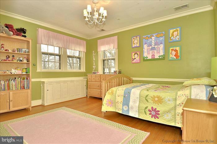9423 Thornhill Road Silver Spring, MD 20901 - Photo 8 of 30 a spacious bedroom with a bed and window