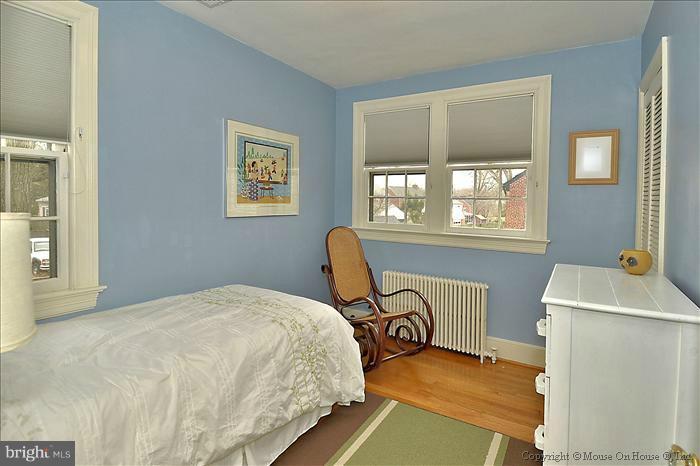 9423 Thornhill Road Silver Spring, MD 20901 - Photo 9 of 30 a bedroom with a bed and a window