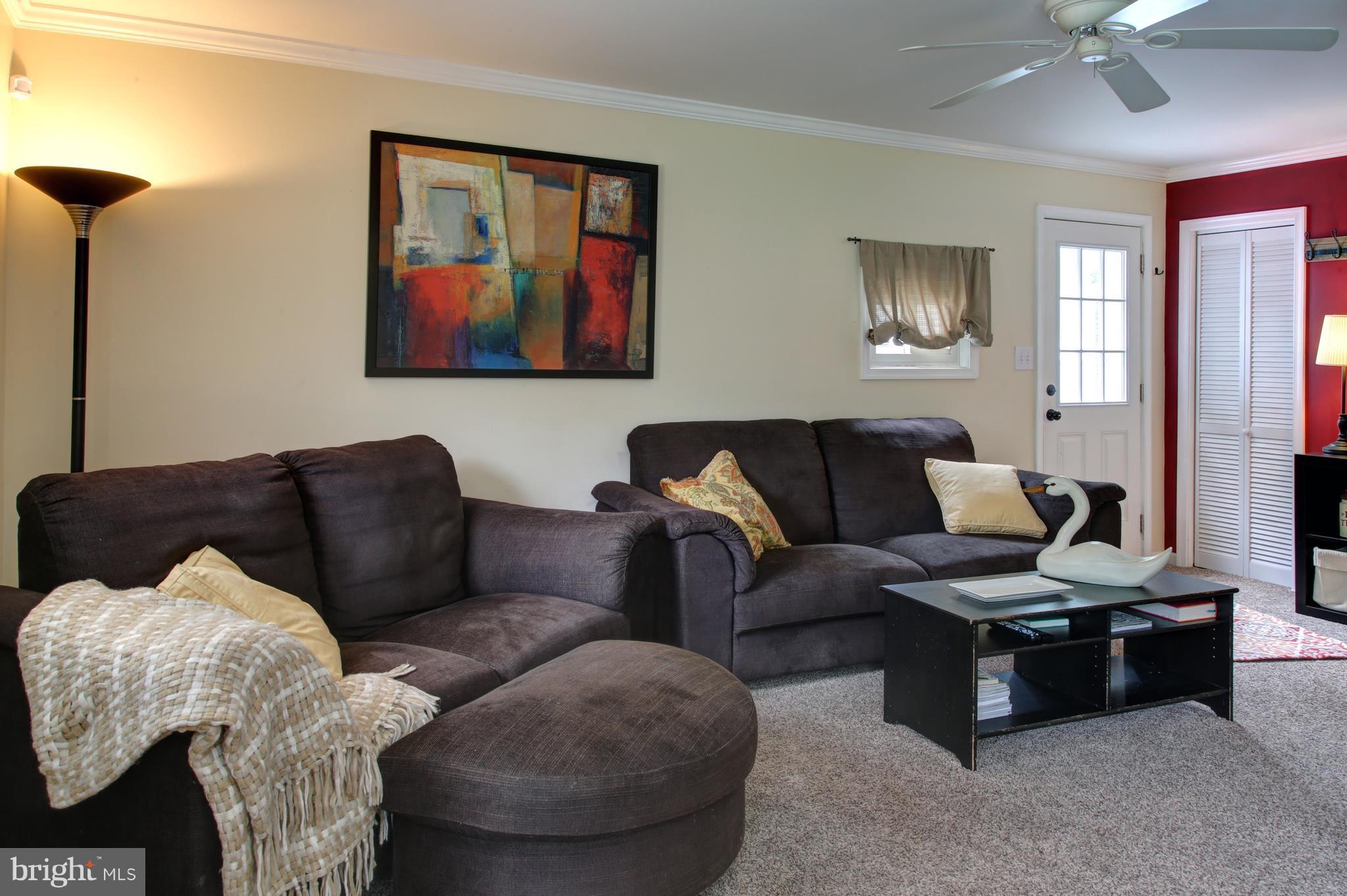 505 Sunset Knoll Road Pasadena, MD 21122 - Photo 13 of 26 OPEN LIVING ROOM WITH WALL MOUNTED TV.