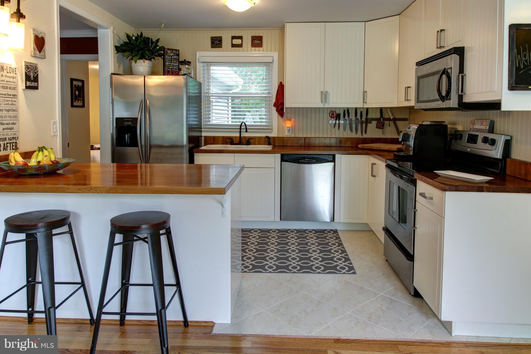 505 Sunset Knoll Road Pasadena, MD 21122 - Photo 3 of 26 TOTALLY REDONE. NEW CABINETS. CERAMIC TILE.