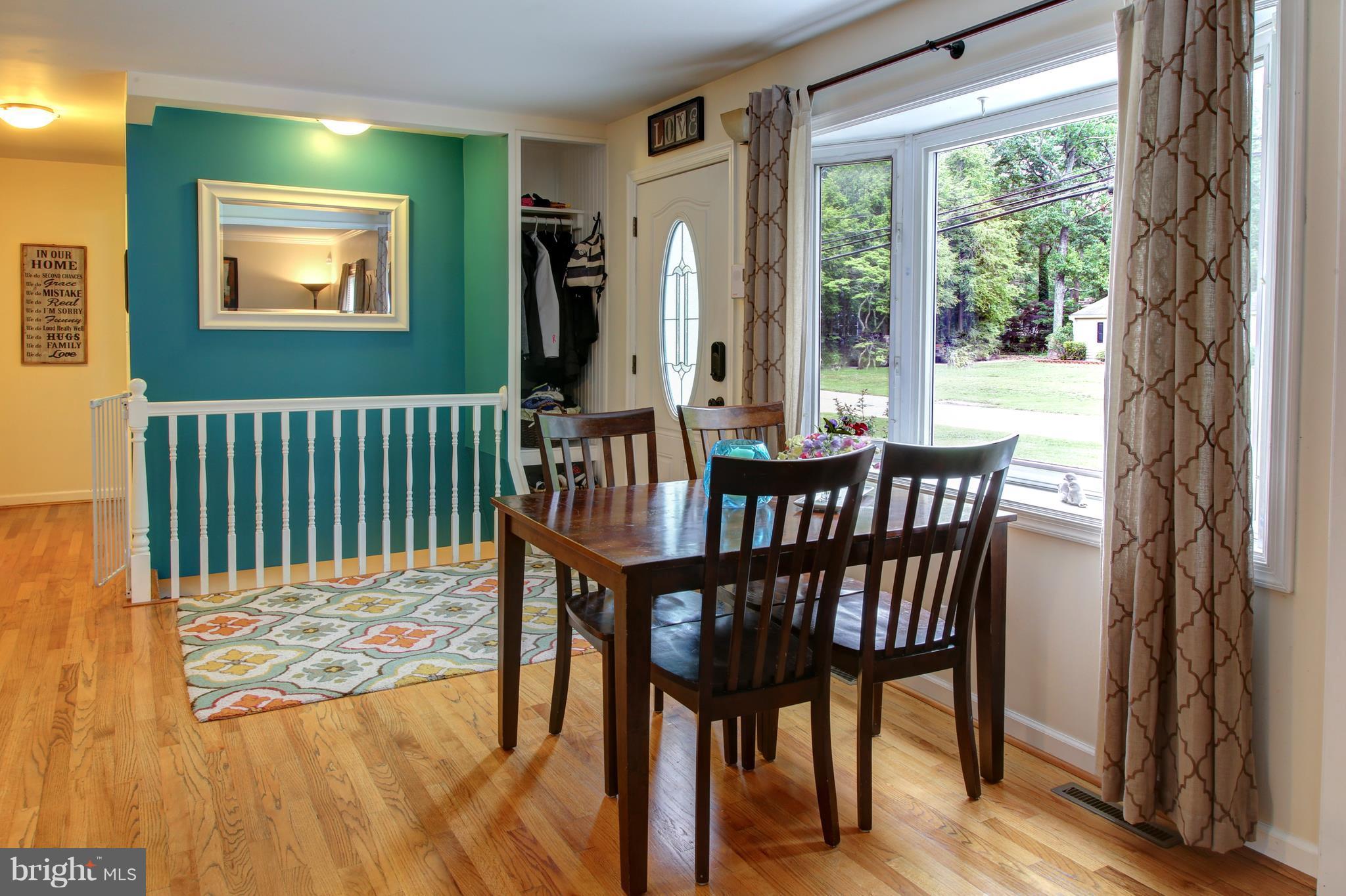505 Sunset Knoll Road Pasadena, MD 21122 - Photo 5 of 26 DINING AREA OVERLOOKING BAY WINDOW.