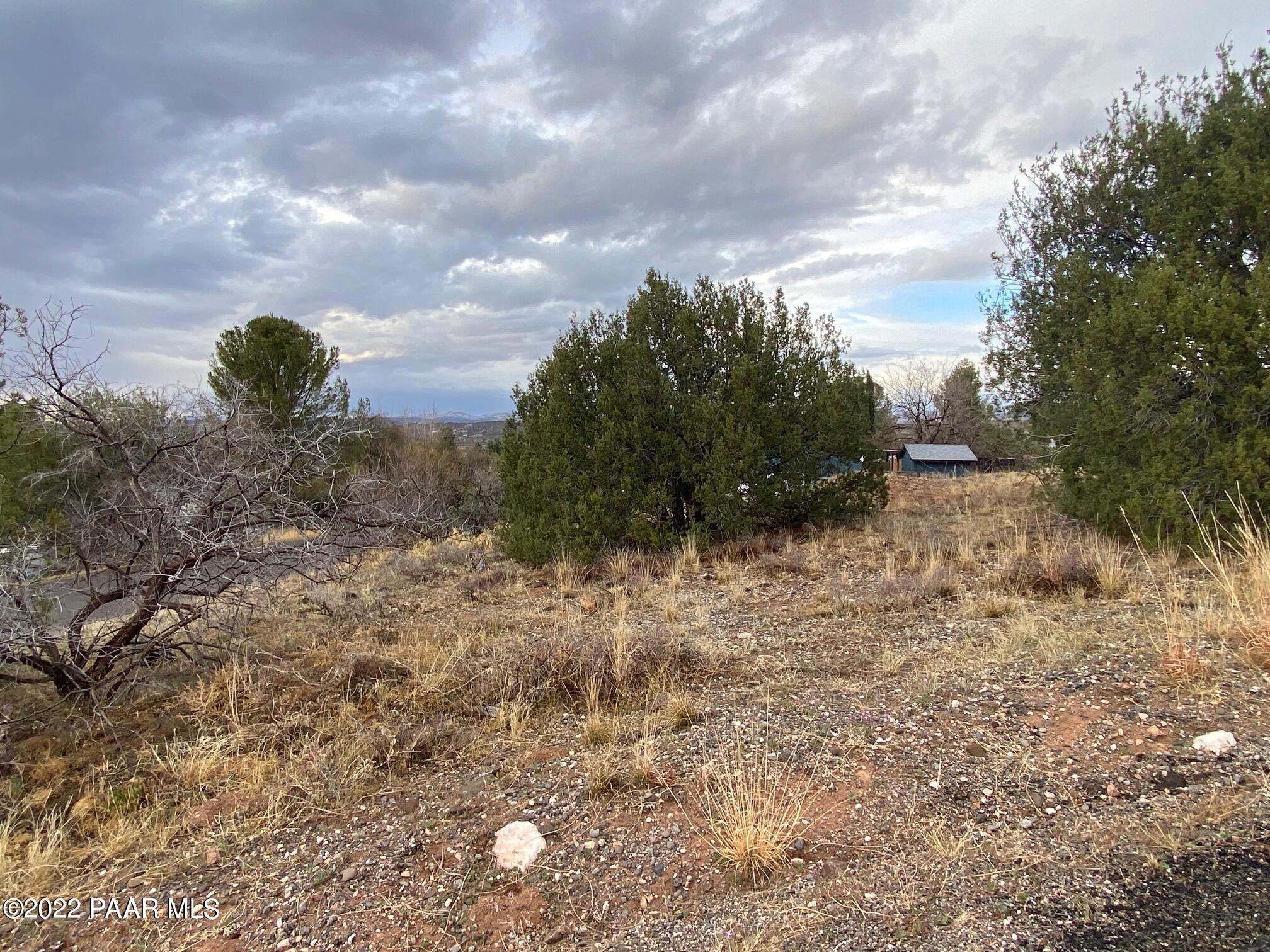 4869 North Gone Fishin Road Rimrock, AZ 86335 - Photo 6 of 10 a view of a dry yard with wooden fence