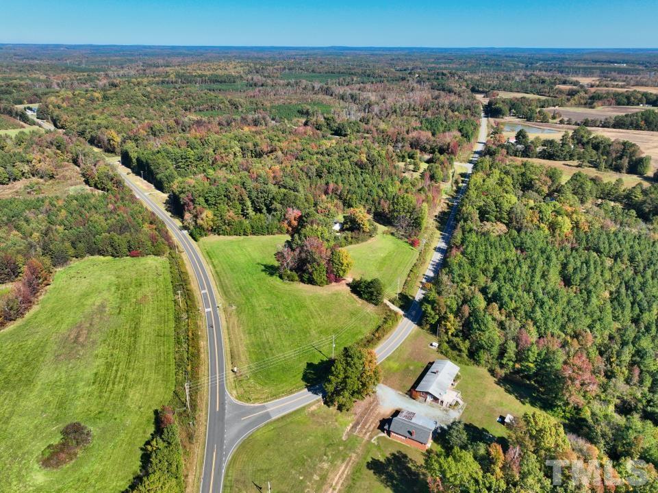 111 Berea Road Rougemont, NC 27572 - Photo 6 of 14 an aerial view of a residential houses with outdoor space and trees