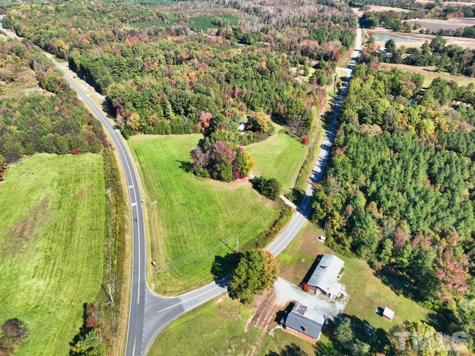 111 Berea Road Rougemont, NC 27572 - Photo 8 of 14 an aerial view of residential house with outdoor space and trees all around