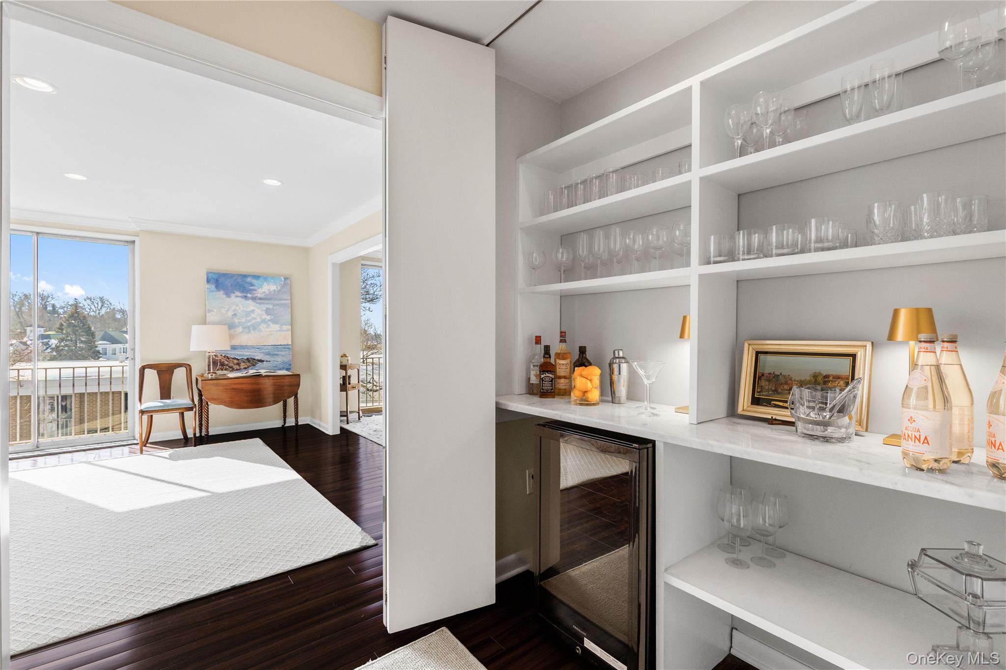 720 Milton Road, Unit SOUTH 3B Rye, NY 10580 - Photo 17 of 33 A wall of hallway closets open to reveal a built in bar for endless entertaining...