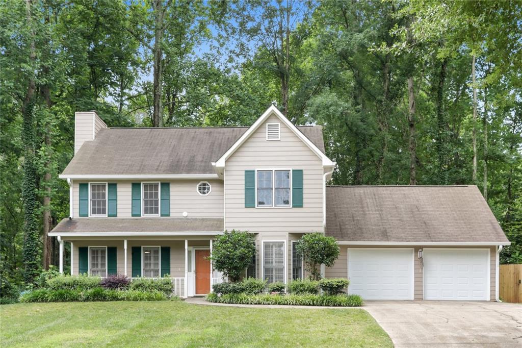 front view of a house with a yard