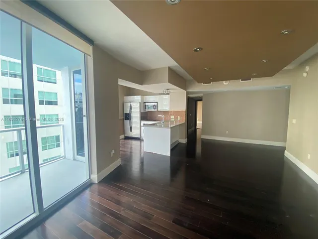 a view of a living room with hardwood floor