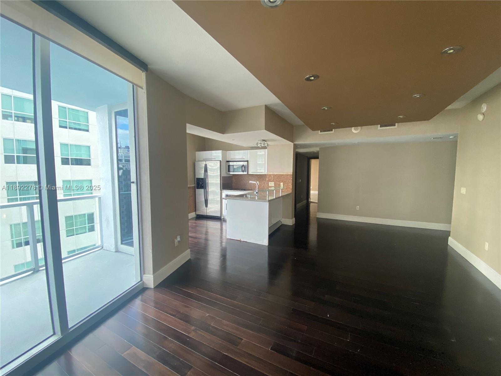 185 Southwest 7th Street, Unit 2312 Miami, FL 33130 - Photo 1 of 32 a view of a living room with hardwood floor