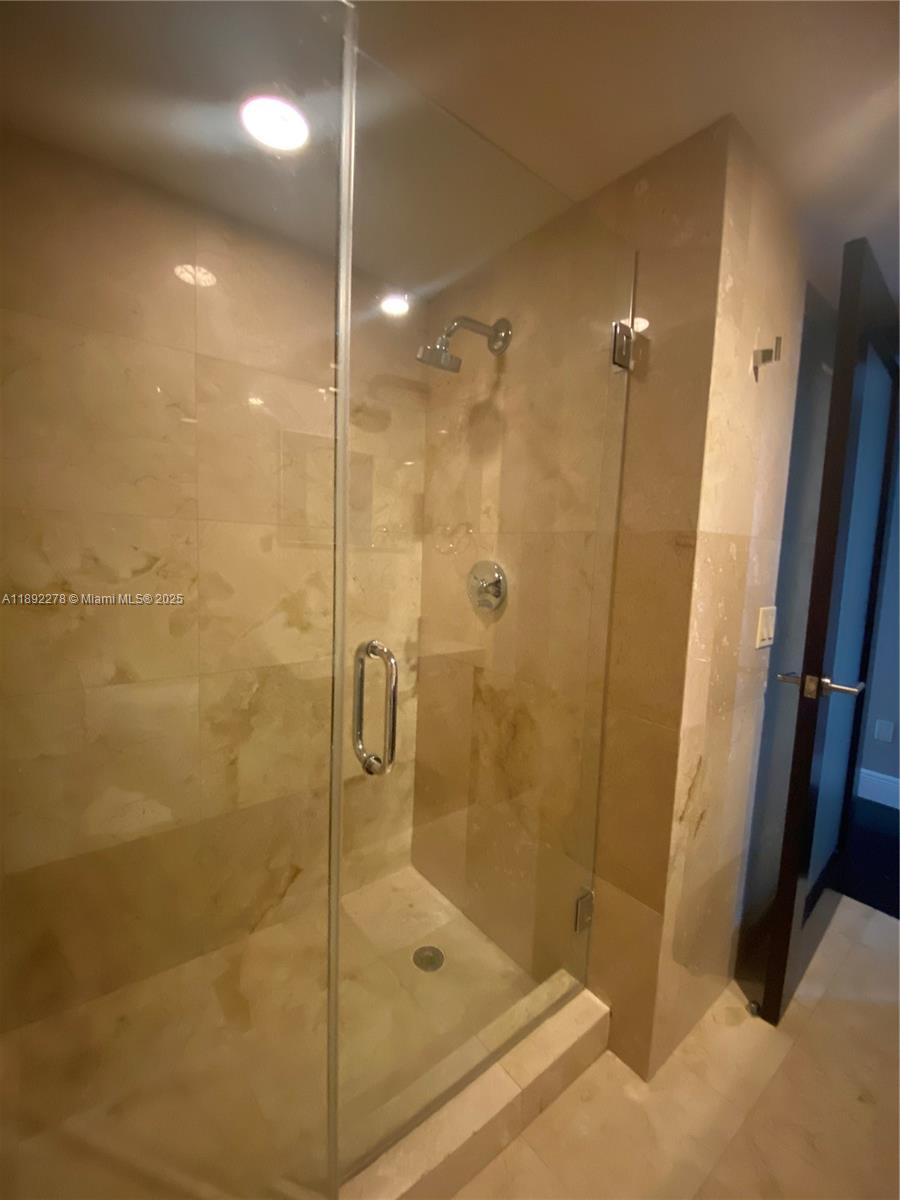 185 Southwest 7th Street, Unit 2312 Miami, FL 33130 - Photo 11 of 32 a bathroom with a shower and a sink