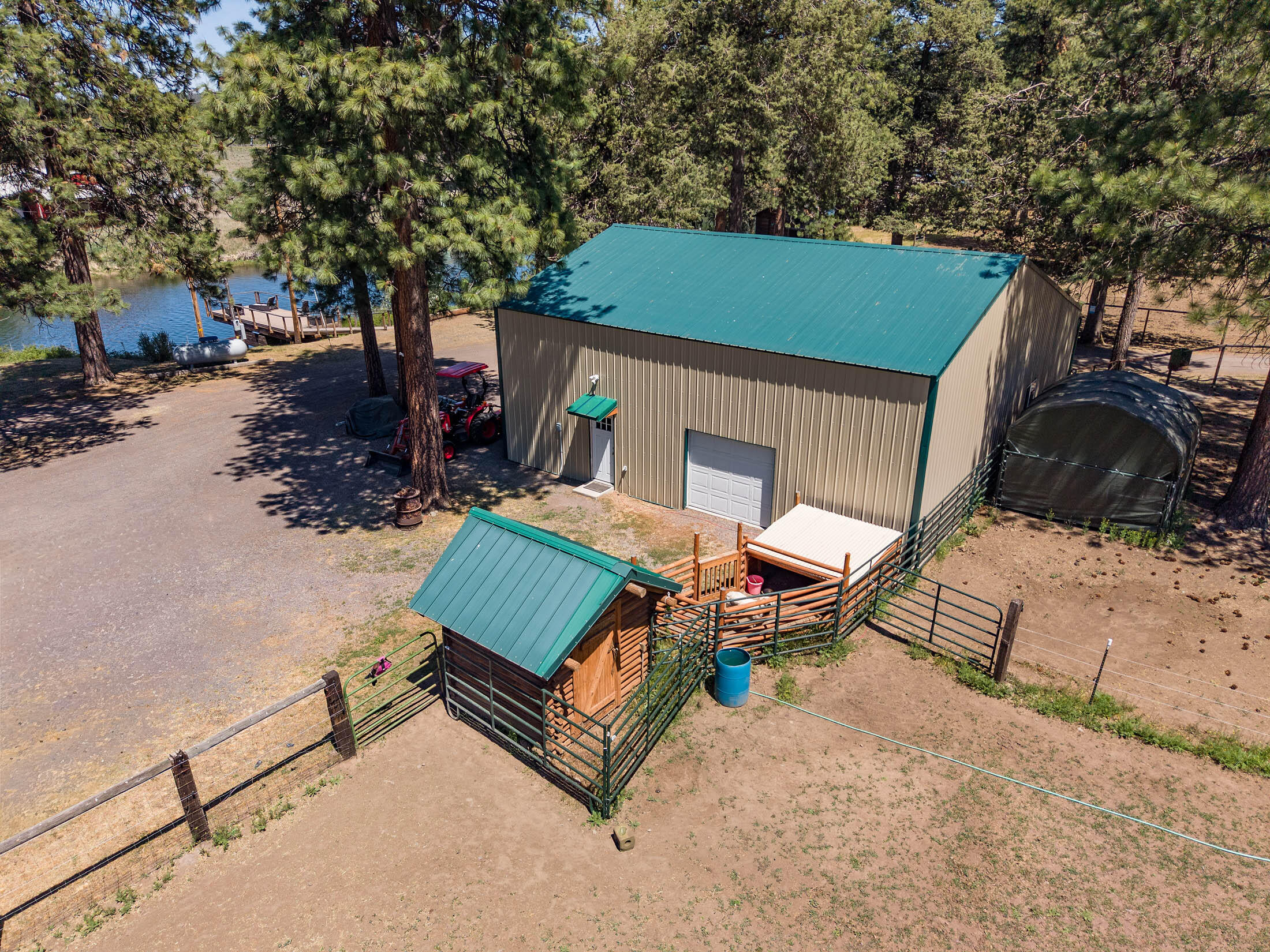 32907 River Bend Road Chiloquin, OR 97624 - Photo 66 of 83 a view of a backyard with chairs and a fire pit