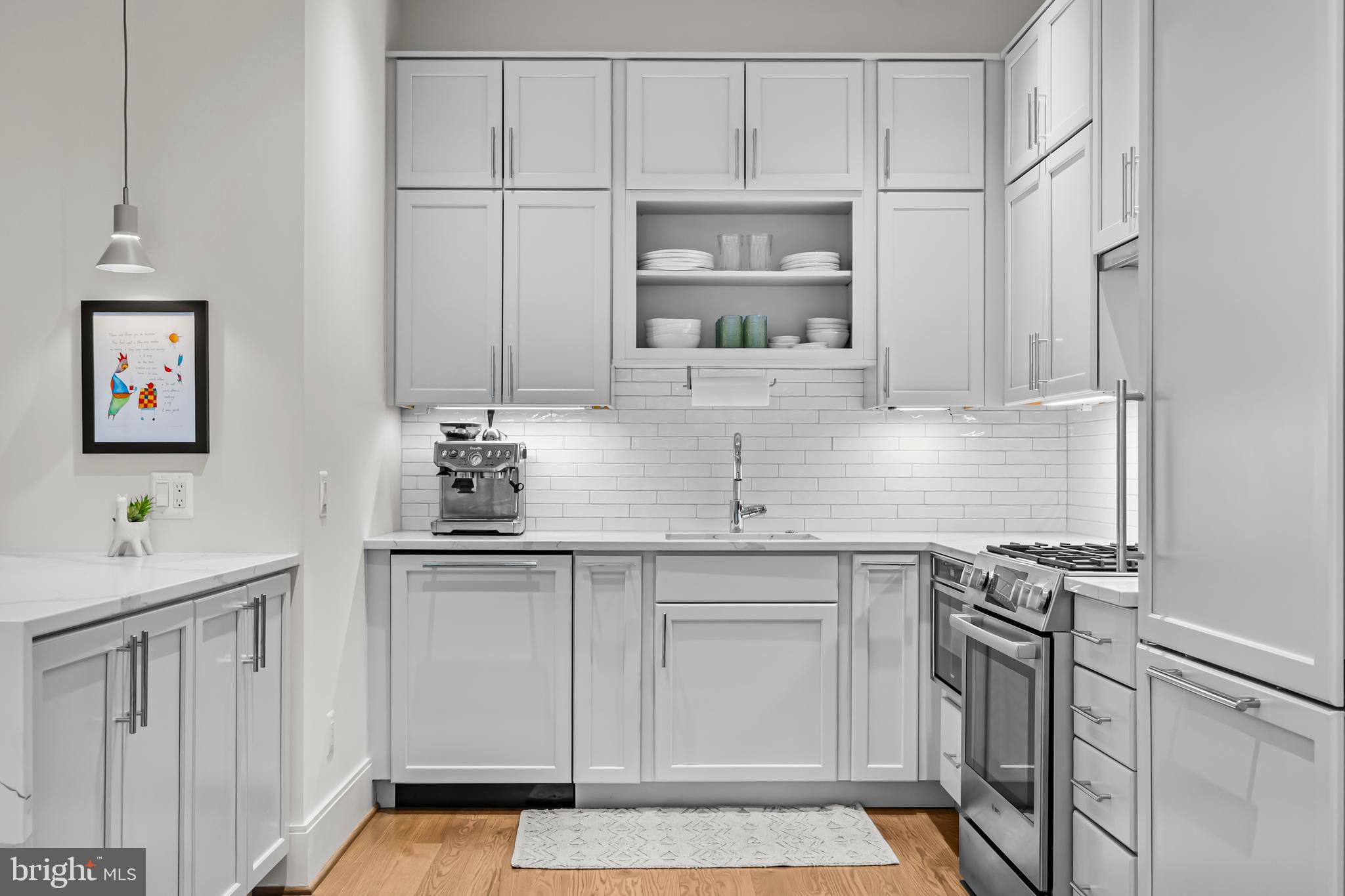270 15th Street Southeast, Unit 301 Washington, DC 20003 - Photo 13 of 31 a kitchen with stainless steel appliances a sink stove and cabinets