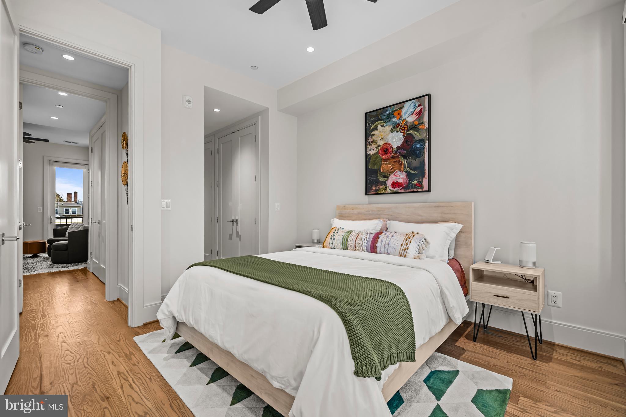 270 15th Street Southeast, Unit 301 Washington, DC 20003 - Photo 18 of 31 a bedroom with a bed and wooden floor